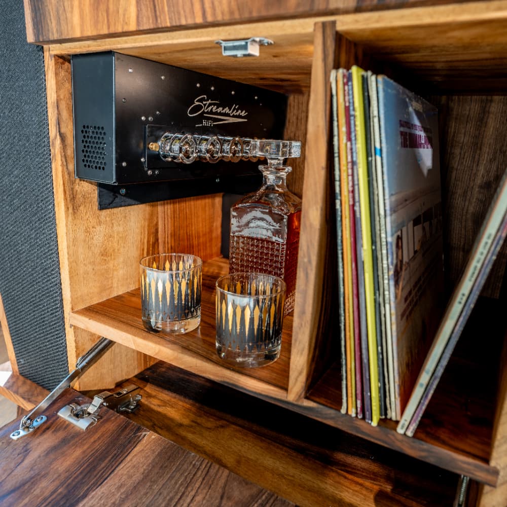 A peak inside a Rambler console revealing the Streamline HiFi Hybrid Amplifier. Vacuum tubes on the front panel of the amplifier.