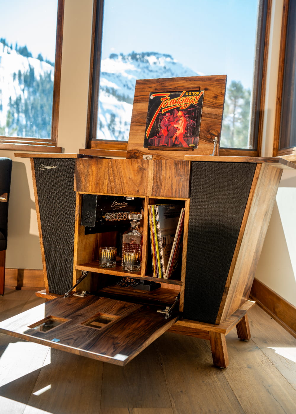 Streamline HiFi Rambler model, built with English walnut, openned to reveal amplifier - in mountain home living room.